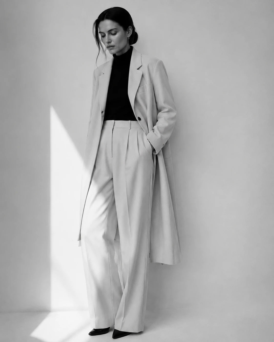 Woman wearing an ivory tailored suit